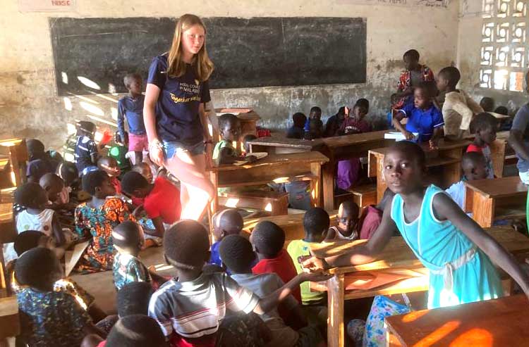 Volunteers handing out donated gifts to Malawi school children