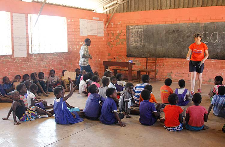 Volunteer teacher in Malawi school classroom
